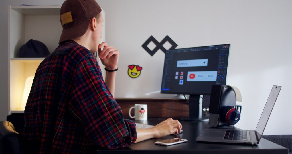 Freelancer sitting near table using computer